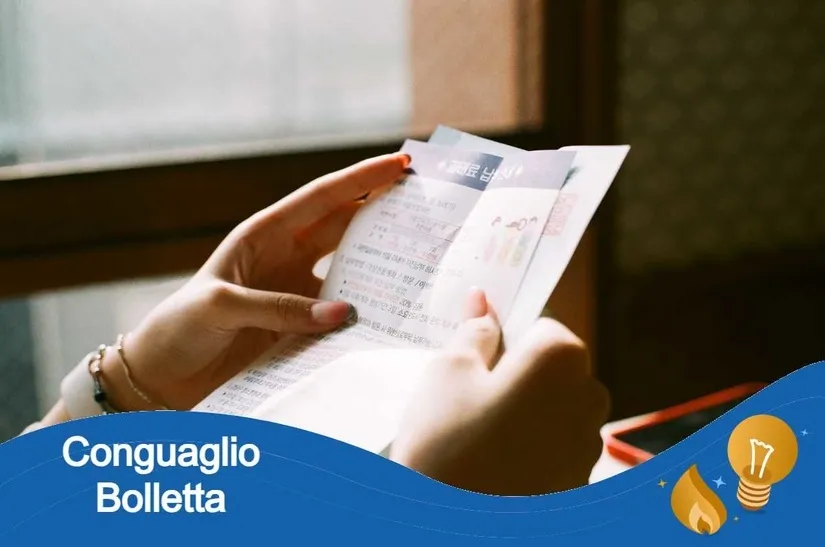 Bolletta con voce 'Conguaglio' cerchiata in rosso accanto a un foglio di letture stimate: simbolo della rettifica fatturata