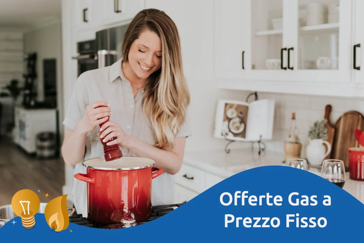Fiamma blu di un fornello a gas e calcolatrice su una bolletta, simbolo del prezzo bloccato